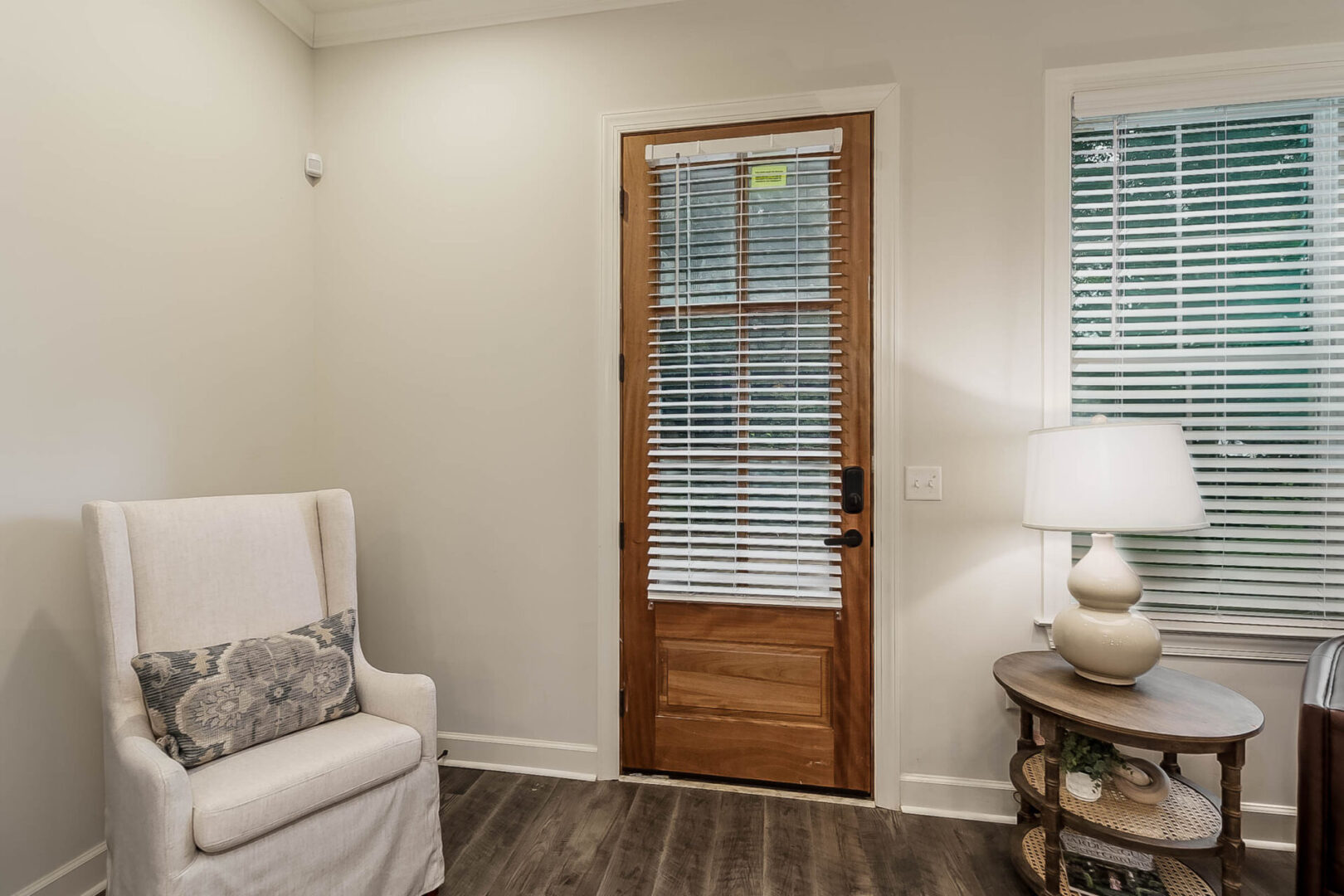 A wooden door with blinds