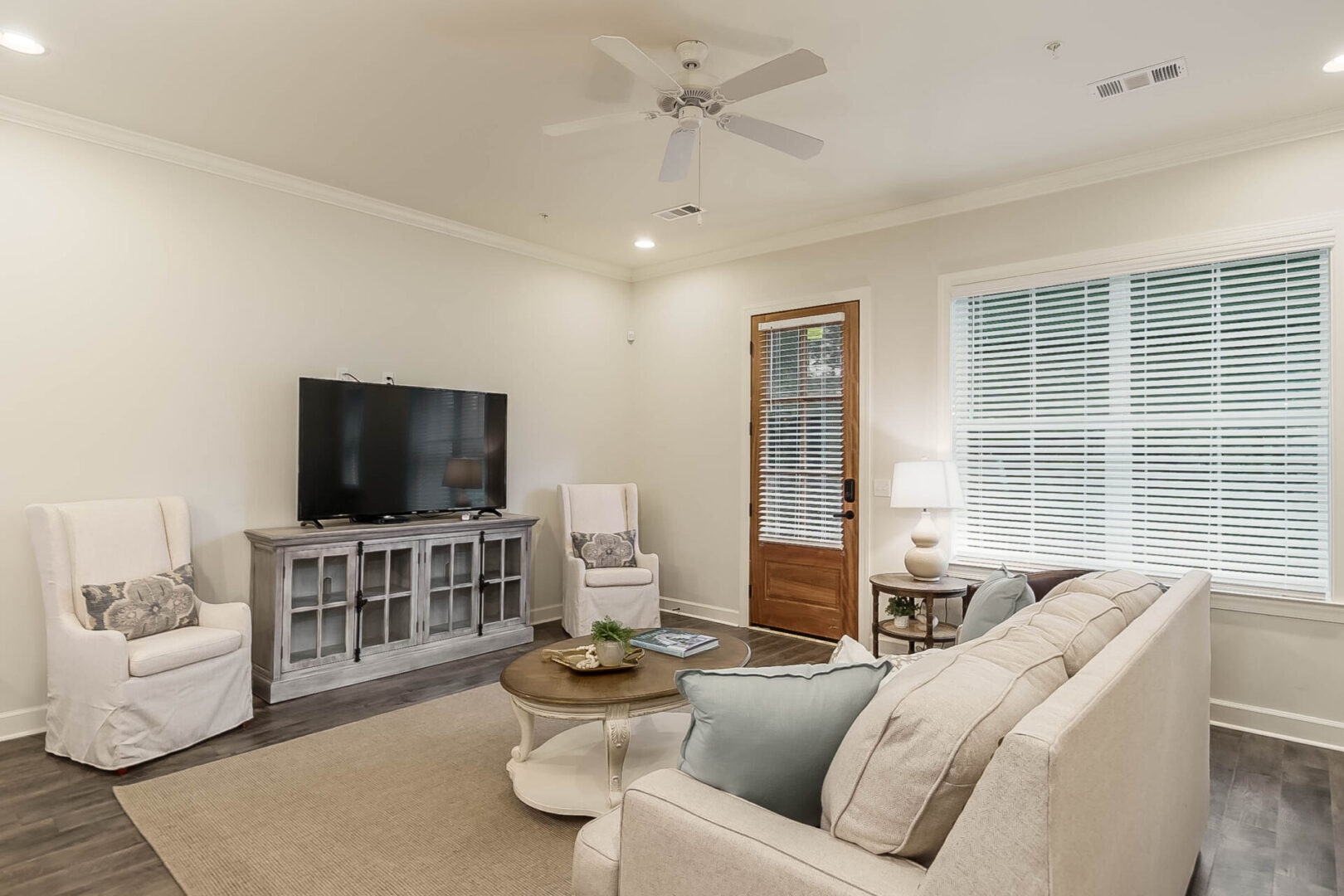 A TV in the living room of a townhome