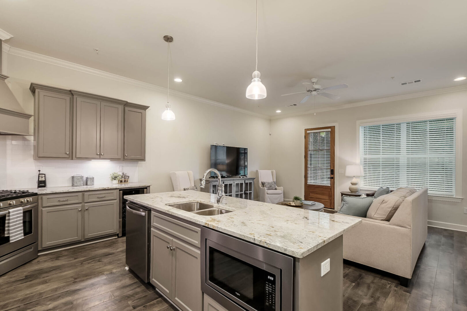 A kitchen island separating the kitchen and living room area