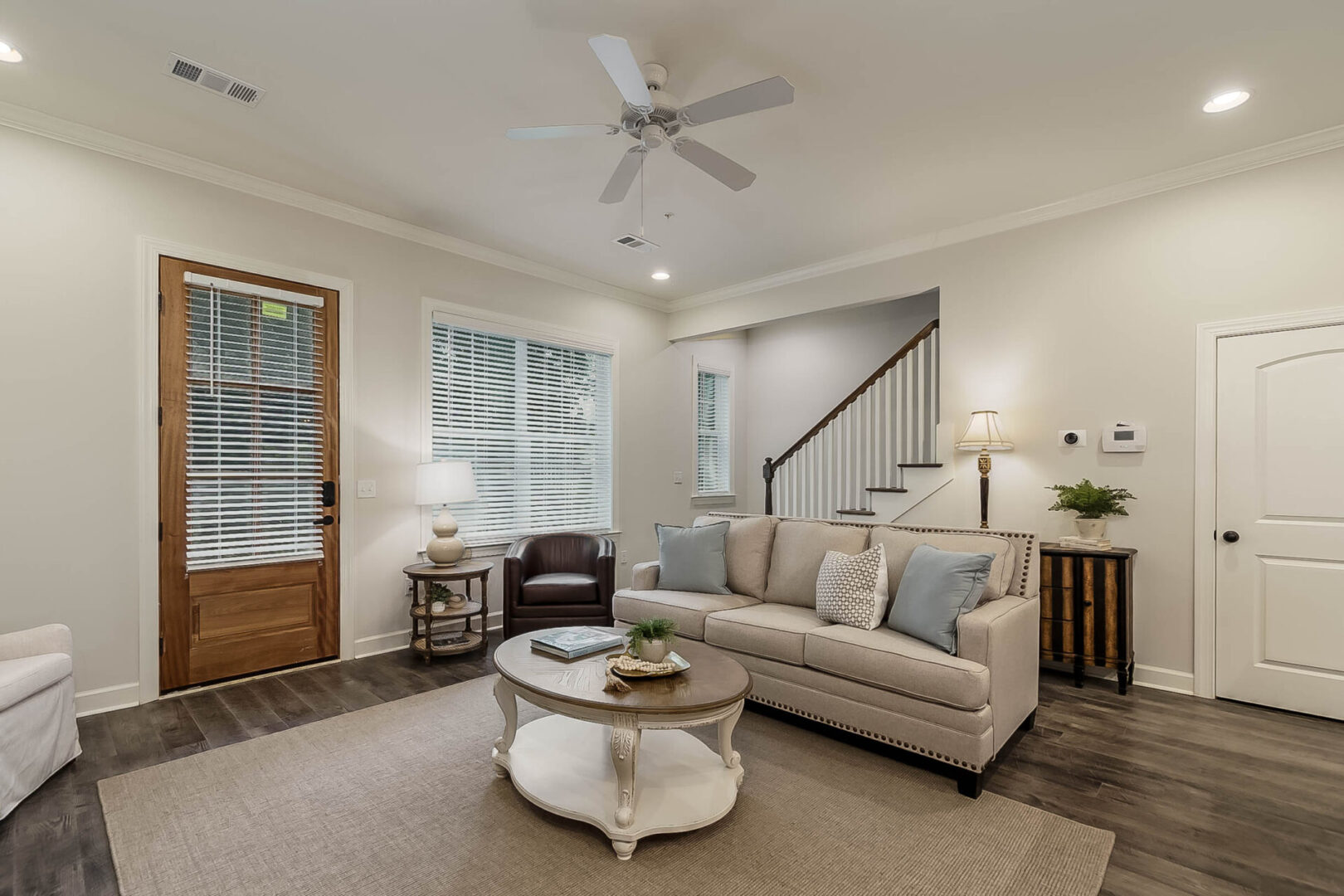 A living room with a ceiling fan