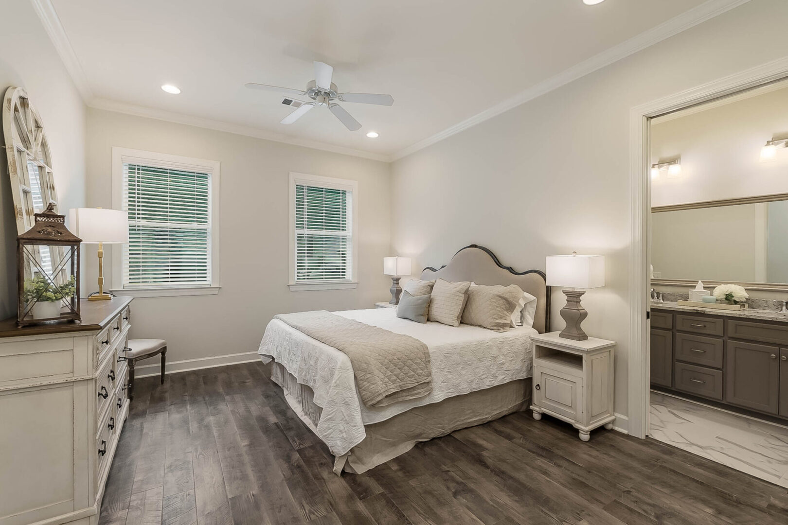 A beautiful bedroom with a ceiling fan