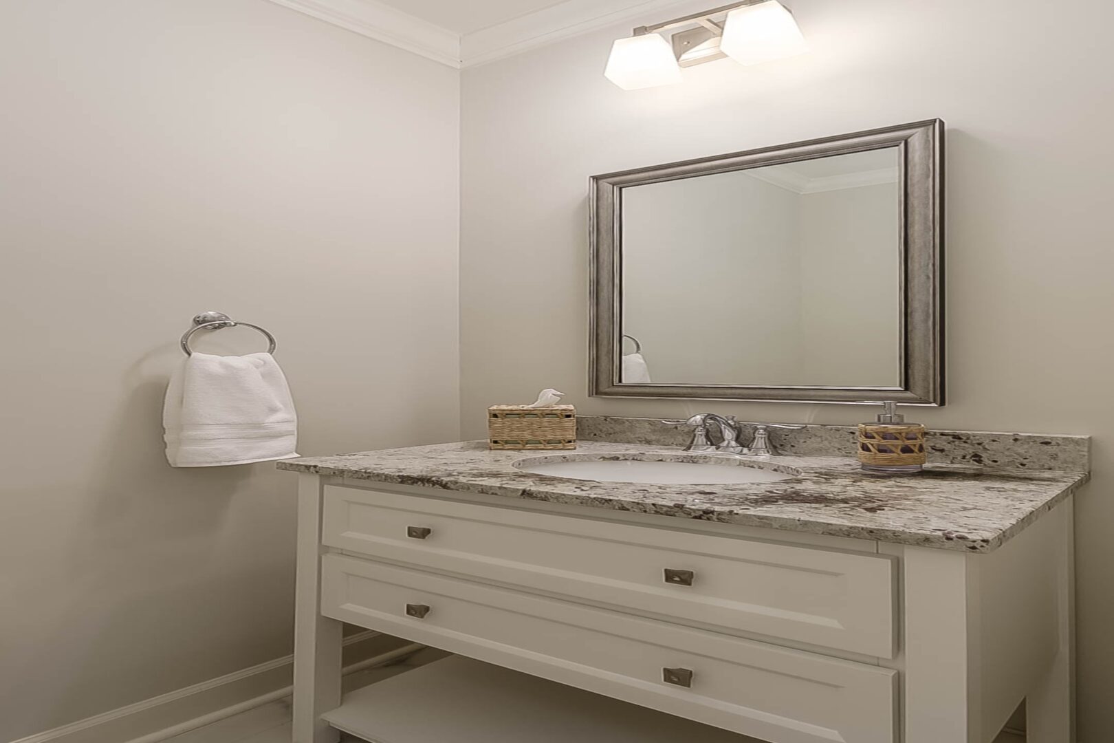 A bathroom sink with a big mirror