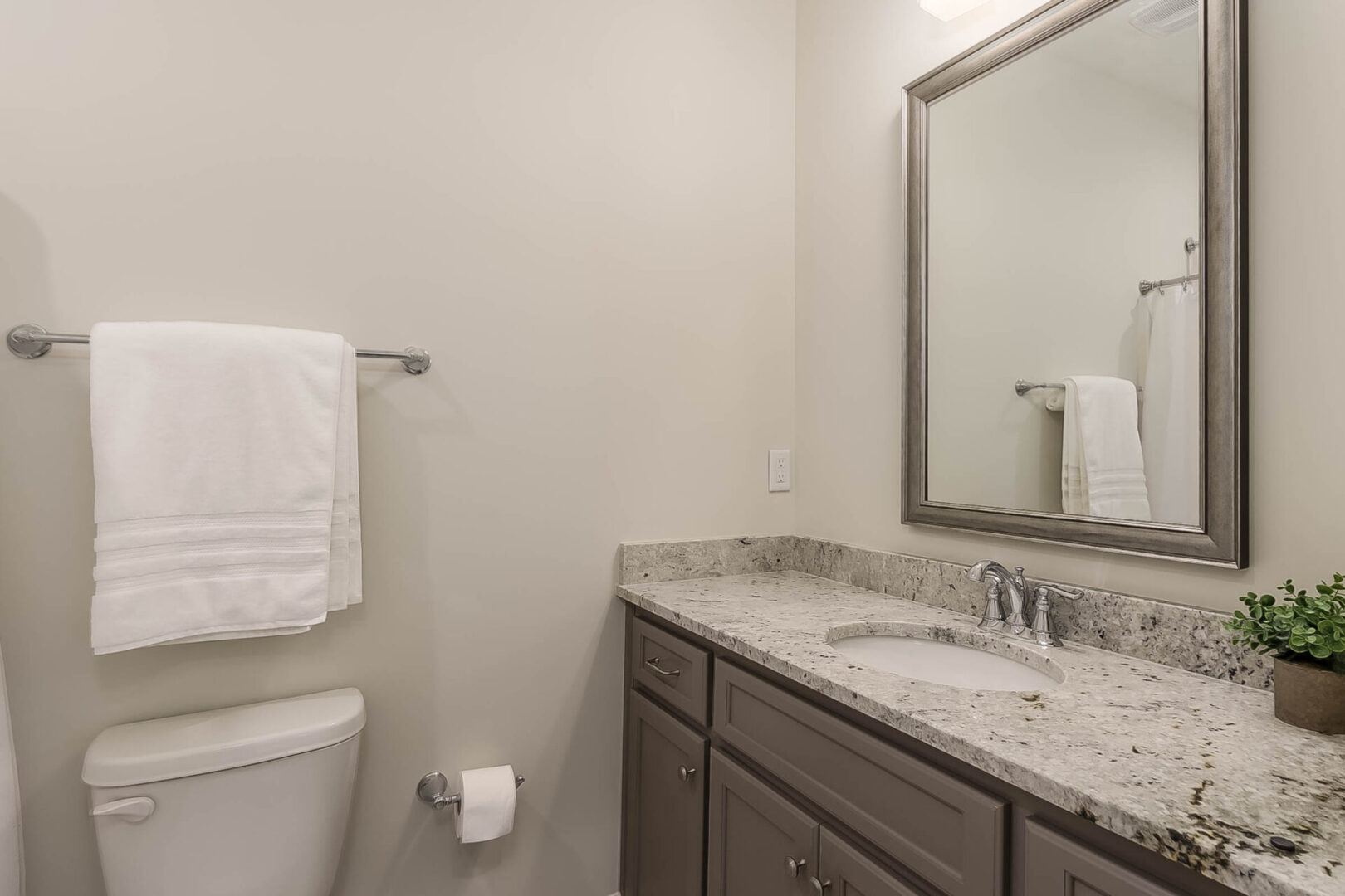 A towel above the toilet