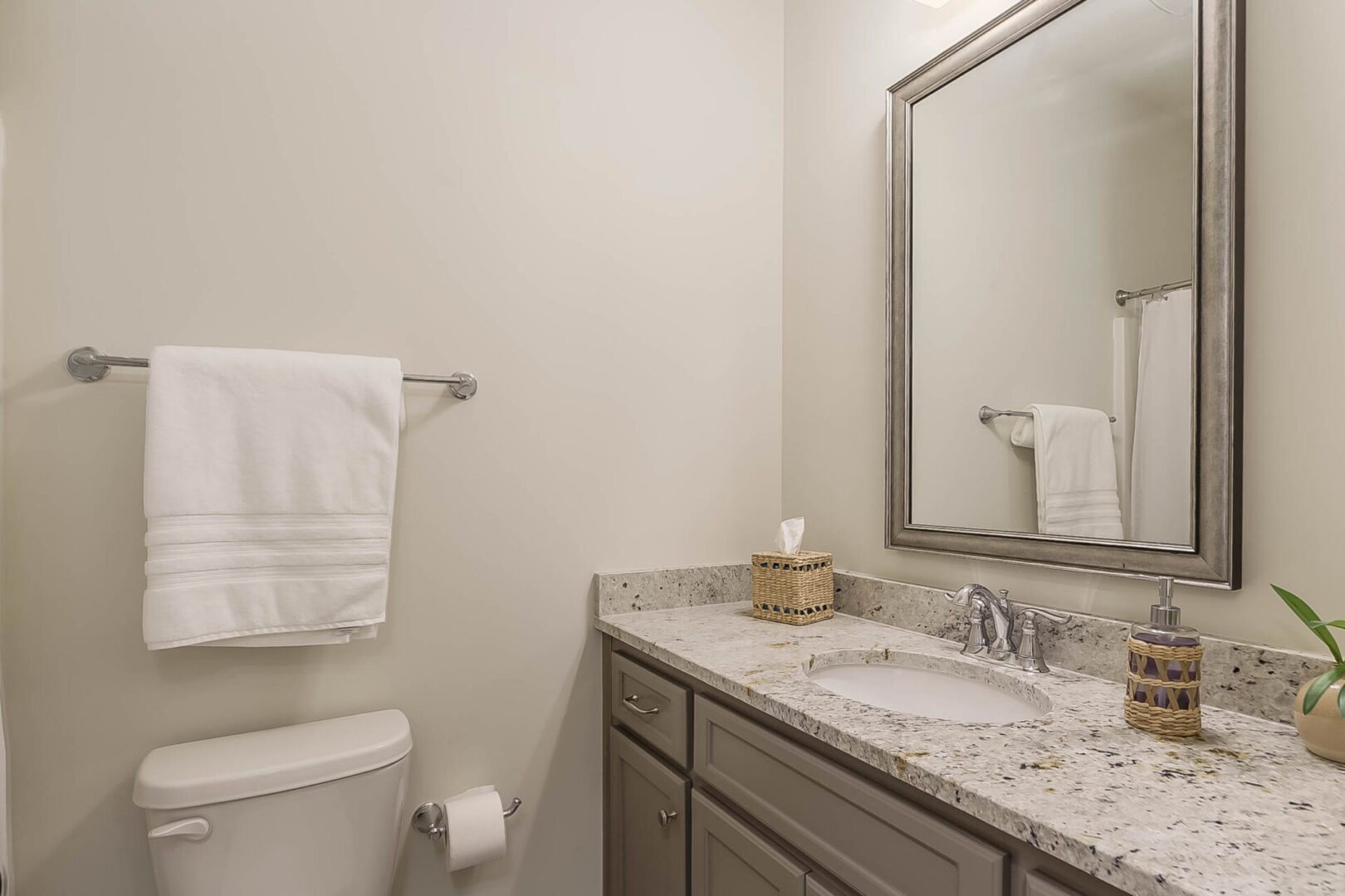 A toilet next to the sink